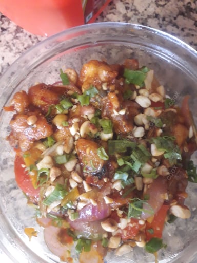 Delicious Kung Pao Chicken prepared by COOX