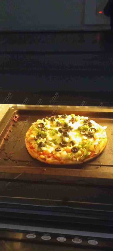 Delicious Veg Pizza prepared by COOX