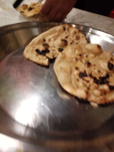 Tasty Naan (Butter / Garlic) cooked by COOX chefs cooks during occasions parties events at home