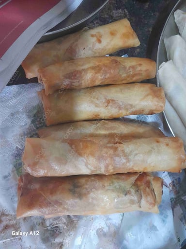 Delicious Veg Spring Rolls prepared by COOX