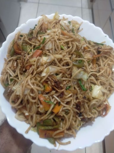 Delicious Veg Hakka Noodles prepared by COOX