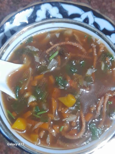 Delicious Vegetable Manchow Soup prepared by COOX