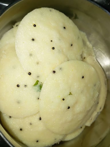 Tasty Rava Idli cooked by COOX chefs cooks during occasions parties events at home