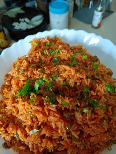 Delicious Schezwan Fried Rice prepared by COOX