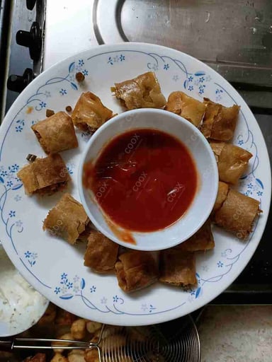 Delicious Veg Spring Rolls prepared by COOX