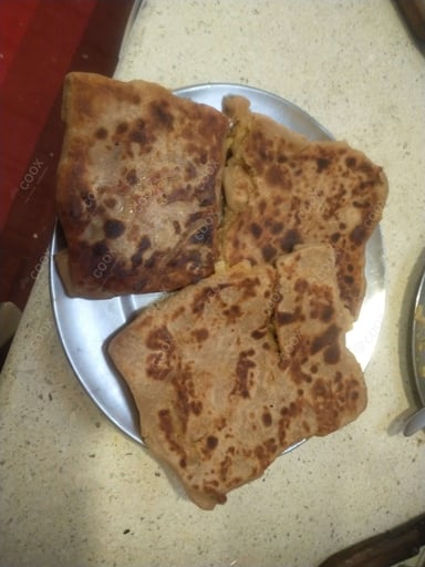 Delicious Stuffed Paranthas prepared by COOX