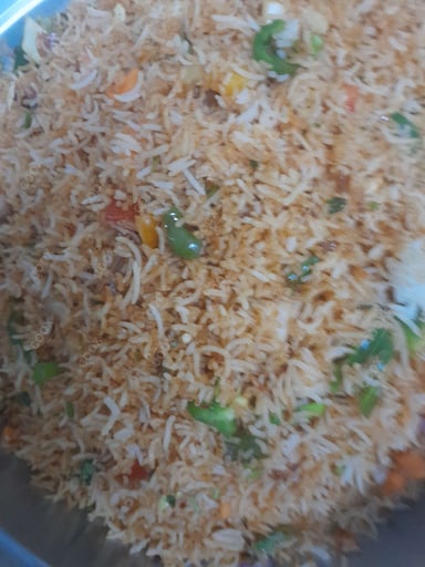 Delicious Schezwan Fried Rice prepared by COOX