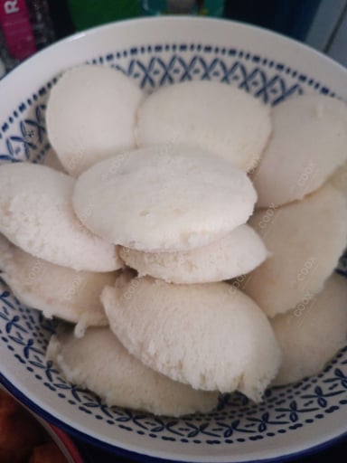 Tasty Plain Idli cooked by COOX chefs cooks during occasions parties events at home