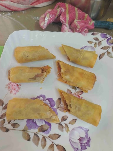 Delicious Veg Spring Rolls prepared by COOX