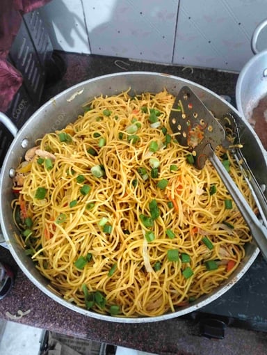 Tasty Chicken Hakka Noodles cooked by COOX chefs cooks during occasions parties events at home