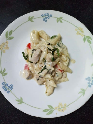 Tasty Chicken Pasta in White Sauce cooked by COOX chefs cooks during occasions parties events at home