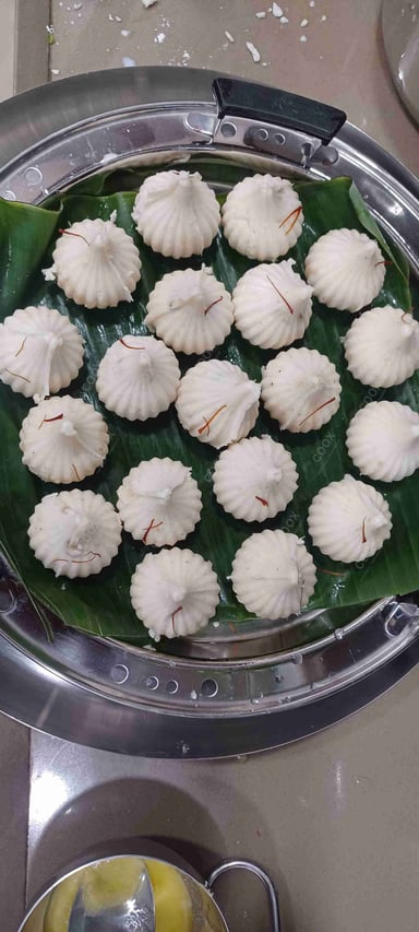 Tasty Modak cooked by COOX chefs cooks during occasions parties events at home