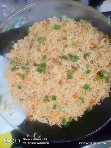 Tasty Schezwan Fried Rice cooked by COOX chefs cooks during occasions parties events at home