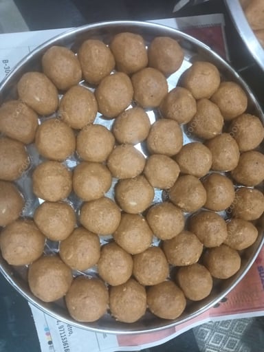 Tasty Besan Ladoo cooked by COOX chefs cooks during occasions parties events at home