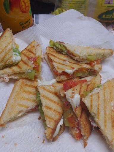 Tasty Grilled Veg Sandwiches cooked by COOX chefs cooks during occasions parties events at home