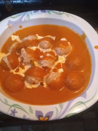 Tasty Malai Kofta (Orange Gravy) cooked by COOX chefs cooks during occasions parties events at home