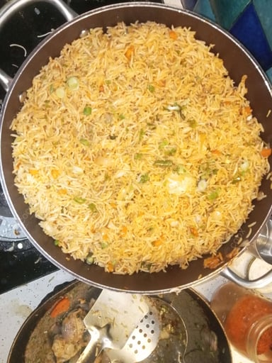 Tasty Schezwan Fried Rice cooked by COOX chefs cooks during occasions parties events at home