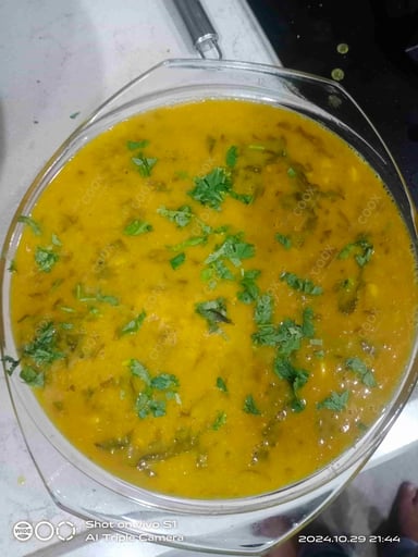 Tasty Palak Dal cooked by COOX chefs cooks during occasions parties events at home