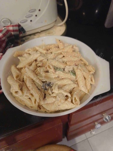 Tasty Chicken Pasta in White Sauce cooked by COOX chefs cooks during occasions parties events at home