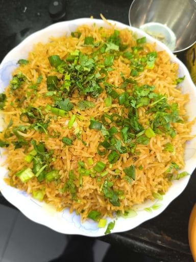 Tasty Schezwan Fried Rice cooked by COOX chefs cooks during occasions parties events at home