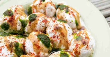 Tasty Dahi Vada cooked by COOX chefs cooks during occasions parties events at home