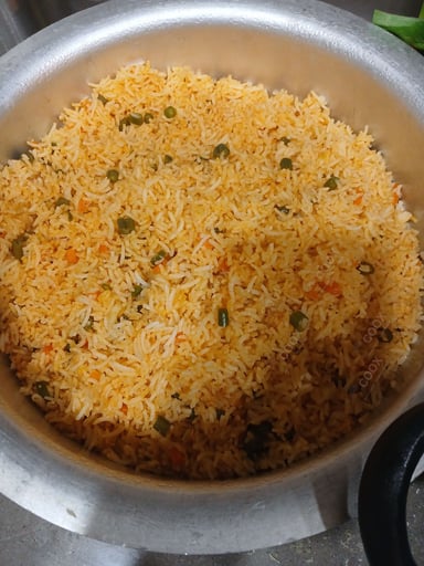 Tasty Schezwan Fried Rice cooked by COOX chefs cooks during occasions parties events at home