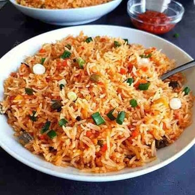 Tasty Schezwan Fried Rice cooked by COOX chefs cooks during occasions parties events at home