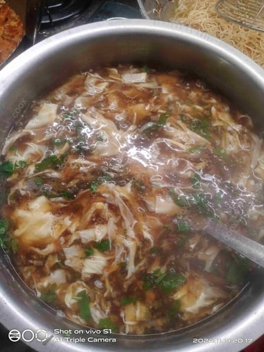 Tasty Chicken Manchow Soup cooked by COOX chefs cooks during occasions parties events at home