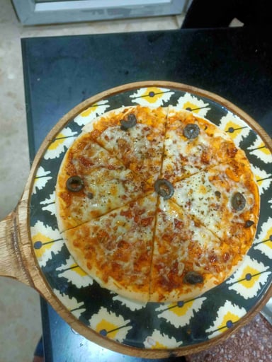 Tasty Margherita Pizza cooked by COOX chefs cooks during occasions parties events at home