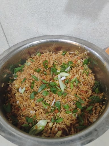 Tasty Schezwan Fried Rice cooked by COOX chefs cooks during occasions parties events at home