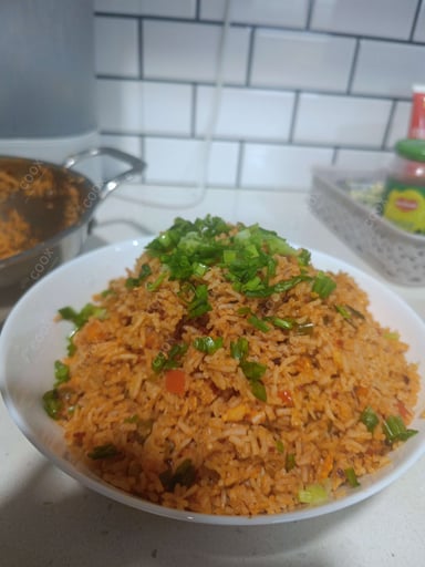 Tasty Schezwan Fried Rice cooked by COOX chefs cooks during occasions parties events at home