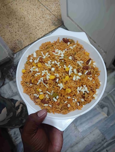 Tasty Mexican Rice cooked by COOX chefs cooks during occasions parties events at home