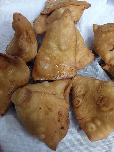 Tasty Keema Samosas cooked by COOX chefs cooks during occasions parties events at home