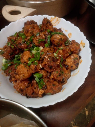 Tasty Chicken Manchurian (Dry) cooked by COOX chefs cooks during occasions parties events at home