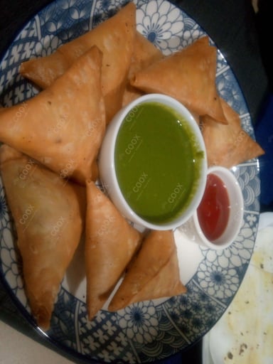 Tasty Keema Samosas cooked by COOX chefs cooks during occasions parties events at home