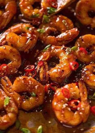 Tasty Red Chilli Prawns cooked by COOX chefs cooks during occasions parties events at home