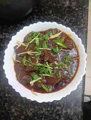 Tasty Mutton Sukha cooked by COOX chefs cooks during occasions parties events at home