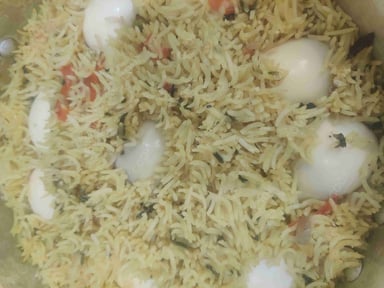 Tasty Egg Biryani cooked by COOX chefs cooks during occasions parties events at home