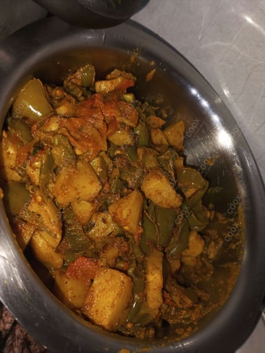 Tasty Aloo Shimla Mirch cooked by COOX chefs cooks during occasions parties events at home