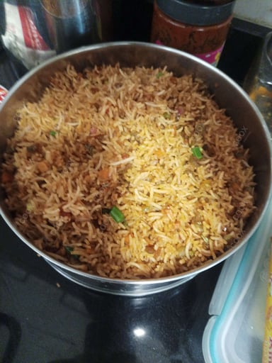 Tasty Schezwan Fried Rice cooked by COOX chefs cooks during occasions parties events at home