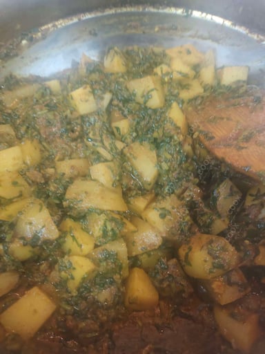 Tasty Aloo Methi cooked by COOX chefs cooks during occasions parties events at home