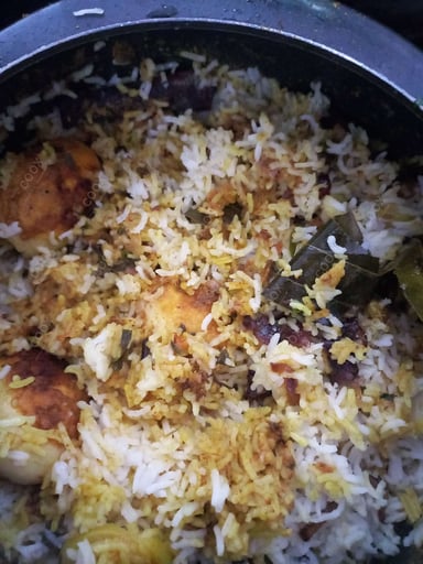 Tasty Egg Biryani cooked by COOX chefs cooks during occasions parties events at home