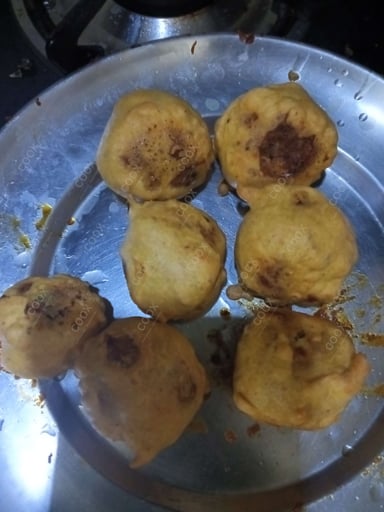 Tasty Aloo Bonda cooked by COOX chefs cooks during occasions parties events at home