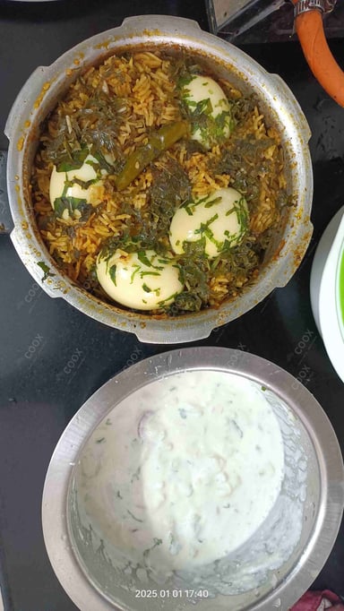 Tasty Egg Biryani cooked by COOX chefs cooks during occasions parties events at home