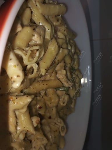 Tasty Chicken Pasta in White Sauce cooked by COOX chefs cooks during occasions parties events at home