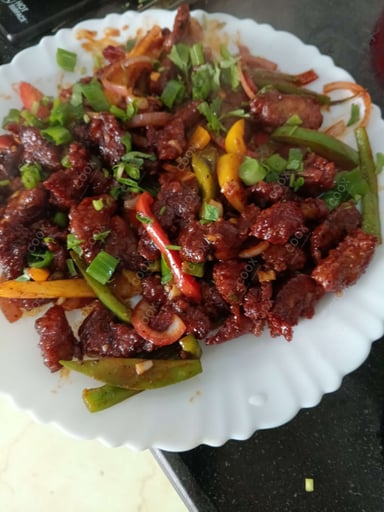 Tasty Crispy Chilli Lamb cooked by COOX chefs cooks during occasions parties events at home