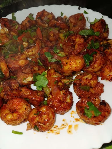 Tasty Red Chilli Prawns cooked by COOX chefs cooks during occasions parties events at home