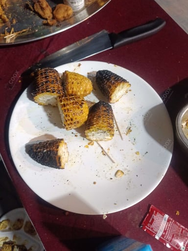 Tasty Grilled Corn cooked by COOX chefs cooks during occasions parties events at home