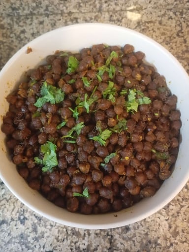 Tasty Kala Chana (Dry) cooked by COOX chefs cooks during occasions parties events at home