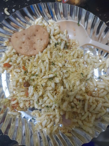 Tasty Bhel Puri cooked by COOX chefs cooks during occasions parties events at home